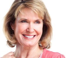 Dental Crowns and Dental Bridges 2 | 1st in Smiles - Dentist Plano, TX A women smiling