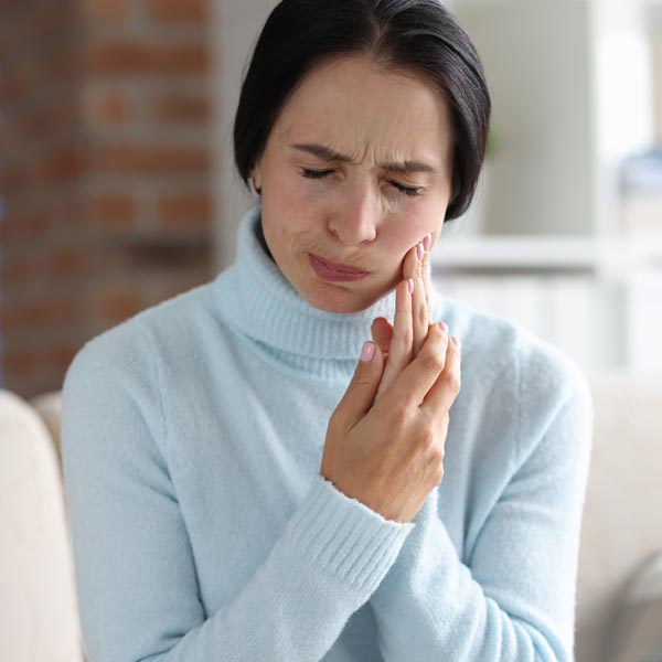 person with TMJ pain