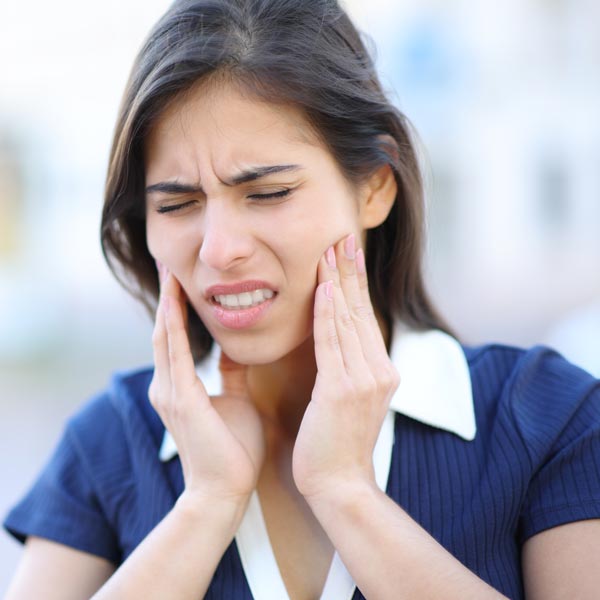 person with tooth pain