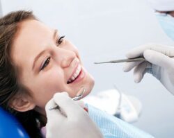 A girl getting a checkup of there teeth's