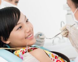 A girl getting a checkup of there teeth's