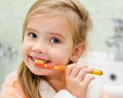 A child brushing her teeth