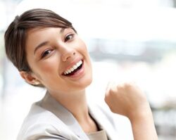 Snap on Smiles 1 | 1st in Smiles - Dentist Plano, TX A women smiling